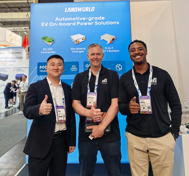 Landworld team discussing EV power products with visitors at IAA TRANSPORTATION 2026